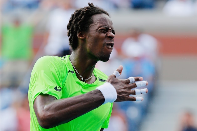 NEW YORK, NY - SEPTEMBER 02:  Gael Monfils of France celebrates after defeating Grigor Dimitrov of Bulgaria in their men's singles fourth round match on Day Nine of the 2014 US Open at the USTA Billie Jean King National Tennis Center on September 2, 2014 in the Flushing neighborhood of the Queens borough of New York City.  (Photo by Mike Stobe/Getty Images for USTA)