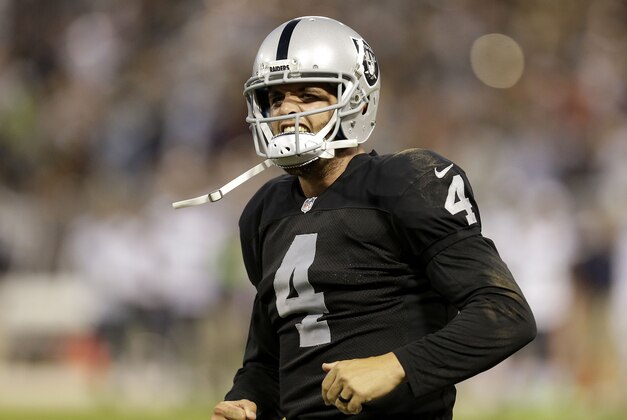 Oakland Raiders quarterback Derek Carr (4) against the Seattle Seahawks during the first half of an NFL preseason football game in Oakland, Calif., Thursday, Aug. 28, 2014. (AP Photo/Ben Margot)