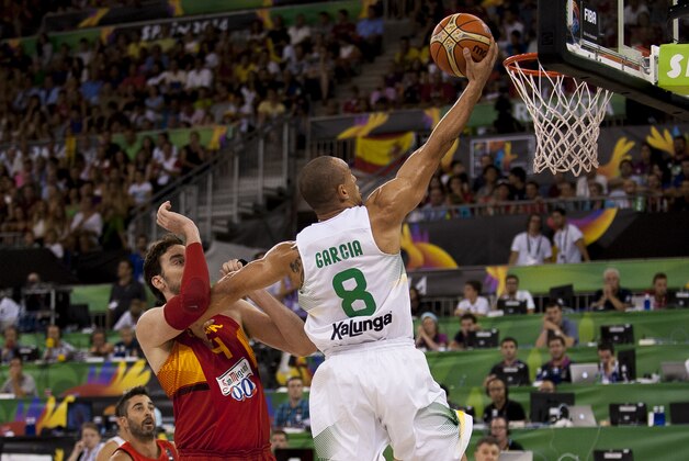 Brazil's Alex Garcia, right, shoots over Spain's Pau Gasol during the Group A Basketball World Cup match between Brazil and Spain in Granada, Spain, Monday Sept. 1, 2014. The 2014 Basketball World Cup competition will take place in various cities in Spain from Aug. 30 through to Sept. 14. (AP Photo/Daniel Tejedor)