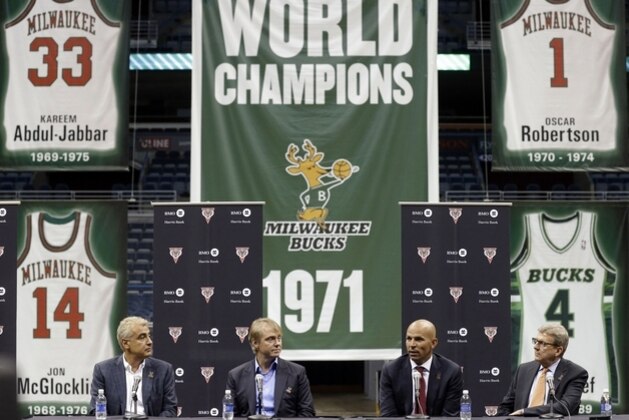 10ThingstoSeeSports - Jason Kidd, second from right, speaks after being named the new head coach of the Milwaukee Bucks, Wednesday, July 2, 2014, in Milwaukee, as Bucks general manager John Hammond, right, listens with team co-owners Marc Lasry, left, and Wesley Edens. (AP Photo/Jeffrey Phelps, File)