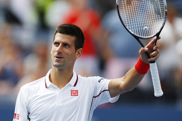 Novak Djokovic, of Serbia, waves to the crowd after defeating Sam Querrey, of the United States, during the third round of the 2014 U.S. Open tennis tournament, Saturday, Aug. 30, 2014, in New York. (AP Photo/Matt Rourke)