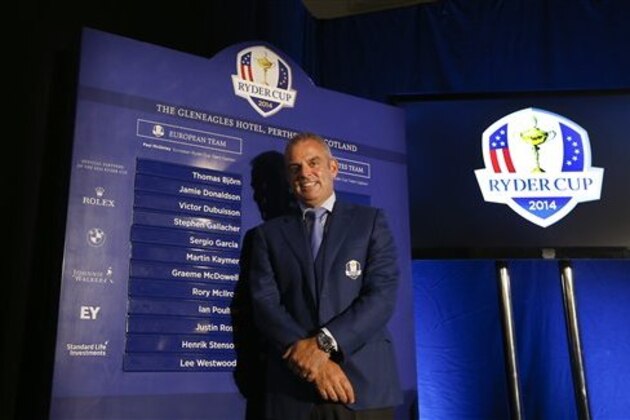 European Ryder cup team captain Paul McGinley stands by a list of his chosen players during a press conference at Wentworth Golf Club to announce his three wild card selections for his team to play at Gleneagles in Scotland against the USA, in Wentworth England, Tuesday, Sept. 2, 2014. (AP Photo/Kirsty Wigglesworth)