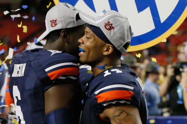 ATLANTA, GA - DECEMBER 07: Quarterback Nick Marshall #14 of the Auburn Tigers and Jeremy Johnson #6 celebrate after defeating the Missouri Tigers 59-42 to win the SEC Championship Game at Georgia Dome on December 7, 2013 in Atlanta, Georgia. (Photo by Kevin C. Cox/Getty Images) ATLANTA, GA - DECEMBER 07: Quarterback Nick Marshall #14 of the Auburn Tigers and Jeremy Johnson #6 celebrate after defeating the Missouri Tigers 59-42 to win the SEC Championship Game at Georgia Dome on December 7, 2013 in Atlanta, Georgia. (Photo by Kevin C. Cox/Getty Images)