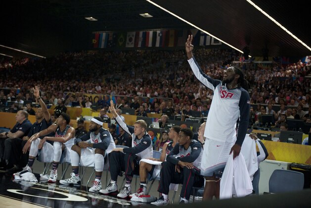 United States's Kenneth Faried, right, cheers his fellow teammate during their match against Finland at the Basketball World Cup in Bilbao, northern Spain, Saturday, Aug. 30, 2014. (AP Photo/Alvaro Barrientos)