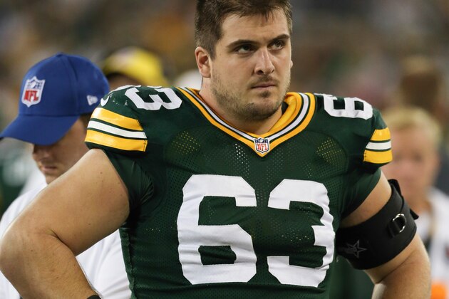 GREEN BAY, WI - AUGUST 28: Corey Linsley #63 of the Green Bay Packers looks on from the sidelines during the preseason game against the Kansas City Chiefs on August 28, 2014 at Lambeau Field in Green Bay, Wisconsin. (Photo by John Konstantaras/Getty Images)