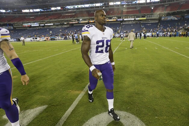 Minnesota Vikings running back Adrian Peterson (28) leaves the field after a preseason NFL football game against the Tennessee Titans Thursday, Aug. 28, 2014, in Nashville, Tenn. The Vikings won 19-3. (AP Photo/Wade Payne)