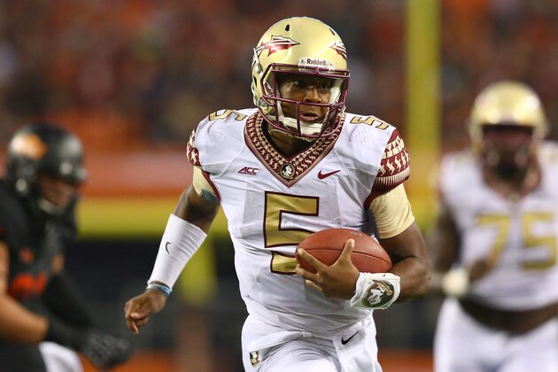 ARLINGTON, TX - AUGUST 30:  Jameis Winston #5 of the Florida State Seminoles runs for a touchdown against the Oklahoma State Cowboys in the second half of the Advocare Cowboys Classic at AT&T Stadium on August 30, 2014 in Arlington, Texas.  (Photo by Ronald Martinez/Getty Images)
