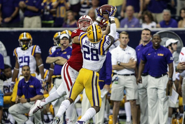 Aug 30, 2014; Houston, TX, USA; LSU Tigers safety Jalen Mills (28) intercepts a pass intended for Wisconsin Badgers tight end Troy Fumagalli (48) during the fourth quarter at NRG Stadium. The Tigers defeated the Badgers 28-24. Mandatory Credit: Troy Taormina-USA TODAY Sports