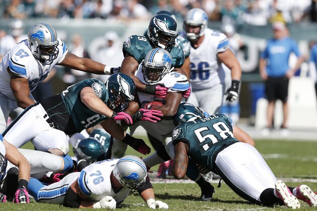 PHILADELPHIA, PA - OCTOBER 14:  Trent Cole #58, DeMeco Ryans #59 and Derek Landri #94 of the Philadelphia Eagles make a tackle against Joique Bell #35 of the Detroit Lions during the game at Lincoln Financial Field on October 14, 2012 in Philadelphia, Pennsylvania. (Photo by Joe Robbins/Getty Images)