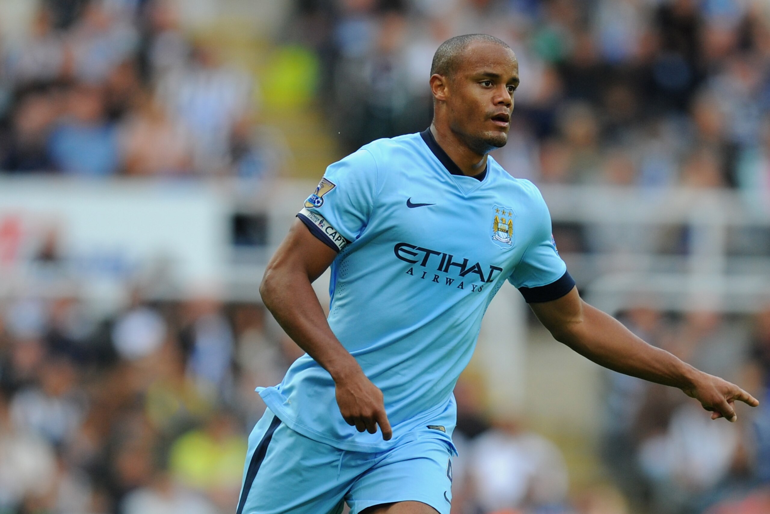 NEWCASTLE UPON TYNE, ENGLAND - AUGUST 17:  Vincent Kompany of Man City in action during the Barclays Premier League match between Newcastle United and Manchester City at St James' Park on August 17, 2014 in Newcastle upon Tyne, England.  (Photo by Stu Forster/Getty Images)