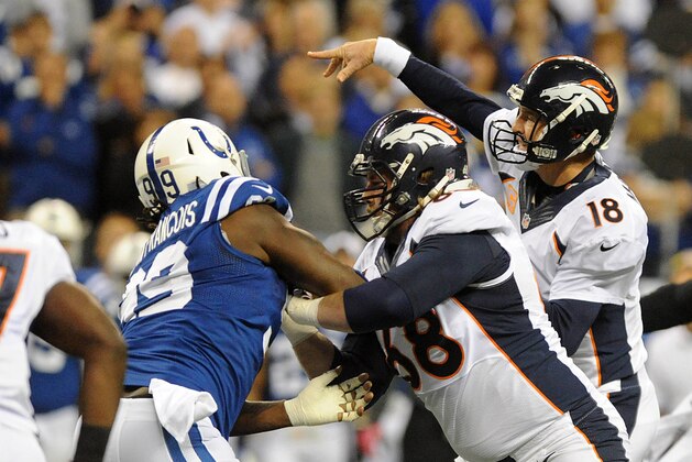 Oct 20, 2013; Indianapolis, IN, USA; Denver Broncos quarterback Peyton Manning (18) throws a pass against the Indianapolis Colts during the first half in the game at Lucas Oil Stadium. Mandatory Credit: Thomas J. Russo-USA TODAY Sports