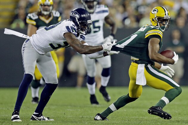 Seattle Seahawks' Brandon Browner tries to tackle Green Bay Packers' Jarrett Boykin during the first half of an NFL preseason football game Friday, Aug. 23, 2013, in Green Bay, Wis. (AP Photo/Morry Gash)