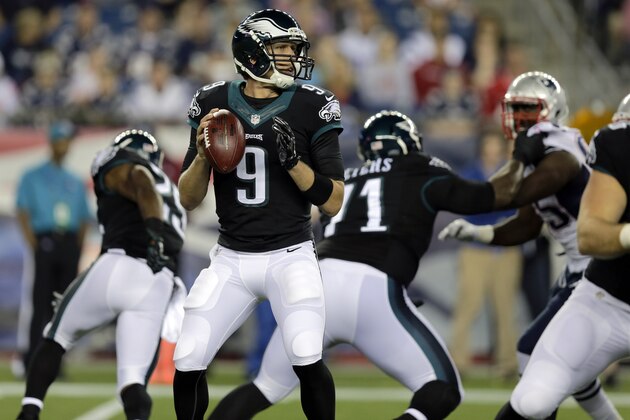 Philadelphia Eagles quarterback Nick Foles (9) looks for a pass receiver against the New England Patriots in the first half of an NFL preseason football game Friday, Aug. 15, 2014, in Foxborough, Mass. (AP Photo/Charles Krupa)