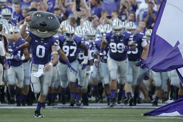 Kansas State mascot Willie the Wildcat leads the team onto the field before an NCAA college football game against Stephen F. Austin Saturday, Aug. 30, 2014, in Manhattan, Kan. (AP Photo/Charlie Riedel)