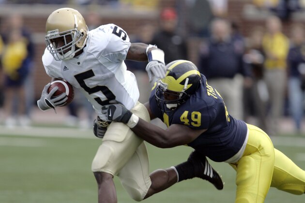 Michigan linebacker John Thompson brings down Notre Dame's Armando Allen (5) during the third quarter of a football game at Michigan Stadium in Ann Arbor, Mich., Saturday, Sept. 15, 2007. Hart ran for 187 yards on 35 carries and scored two touchdowns to help the Wolverines to a 38-0 win over Notre Dame. Michigan handed the Fighting Irish their worst loss since beating them by the same score in 2003. (AP Photo/Carlos Osorio) Michigan linebacker John Thompson brings down Notre Dame's Armando Allen (5) during the third quarter of a football game at Michigan Stadium in Ann Arbor, Mich., Saturday, Sept. 15, 2007. Hart ran for 187 yards on 35 carries and scored two touchdowns to help the Wolverines to a 38-0 win over Notre Dame. Michigan handed the Fighting Irish their worst loss since beating them by the same score in 2003. (AP Photo/Carlos Osorio)