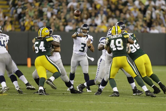 GREEN BAY, WI - AUGUST 23:  Russell Wilson #3 of the Seattle Seahawks makes the pass during the game against the Green Bay Packers at Lambeau Field on August 23, 2013 in Green Bay, Wisconsin.  (Photo by Mike McGinnis/Getty Images)