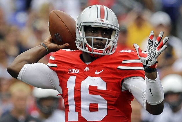 Ohio State quarterback J.T. Barrett throws to a receiver in the first half of an NCAA college football game against Navy in Baltimore, Saturday, Aug. 30, 2014. (AP Photo/Patrick Semansky)