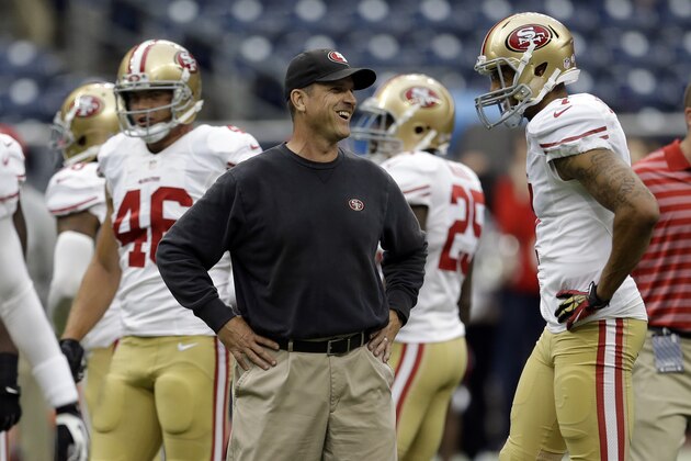 San Francisco 49ers head coach Jim Harbaugh, center, Colin Kaepernick before an NFL football preseason game against the Houston Texans,Thursday, Aug. 28, 2014, in Houston. (AP Photo/David J. Phillip)