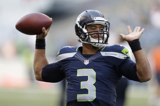 Seattle Seahawks quarterback Russell Wilson throws before a preseason NFL football game against the Chicago Bears, Friday, Aug. 22, 2014, in Seattle. (AP Photo/John Froschauer)