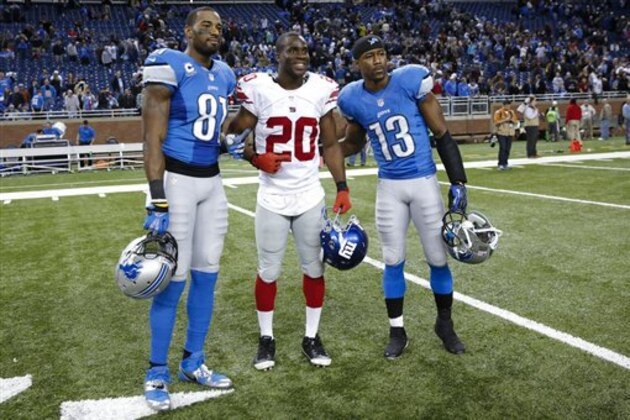 Detroit Lions wide receiver Calvin Johnson (81) New York Giants cornerback Prince Amukamara (20) and Detroit wide receiver Nate Burleson (13) pose for a photo after an NFL football game at Ford Field in Detroit, Sunday, Dec. 22, 2013. (AP Photo/Rick Osentoski) Detroit Lions wide receiver Calvin Johnson (81) New York Giants cornerback Prince Amukamara (20) and Detroit wide receiver Nate Burleson (13) pose for a photo after an NFL football game at Ford Field in Detroit, Sunday, Dec. 22, 2013. (AP Photo/Rick Osentoski)