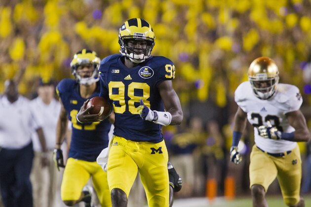 Michigan quarterback Devin Gardner (98) rushes on a break away run in the second quarter of an NCAA college football game with Notre Dame, in Ann Arbor, Mich., Saturday, Sept. 7, 2013. (AP Photo/Tony Ding)