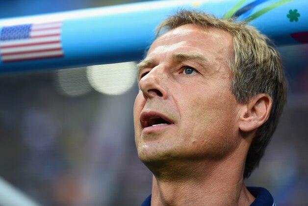 SALVADOR, BRAZIL - JULY 01:  Head coach Jurgen Klinsmann of the United States  sings the National Anthem prior to the 2014 FIFA World Cup Brazil Round of 16 match between Belgium and the United States at Arena Fonte Nova on July 1, 2014 in Salvador, Brazil.  (Photo by Laurence Griffiths/Getty Images)
