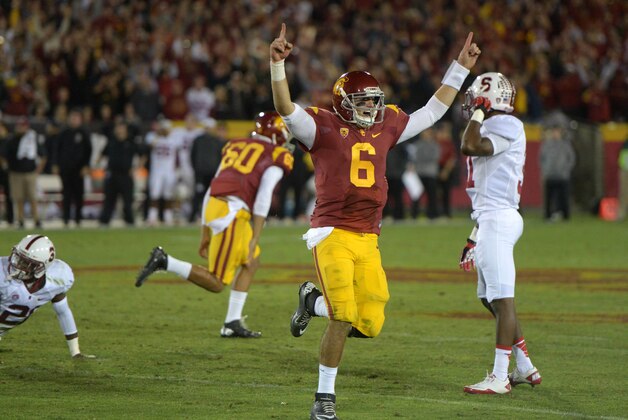 Nov 16, 2013; Los Angeles, CA, USA; Southern California Trojans quarterback Cody Kessler (6) celebrates after a 47-yard field goal by Andre Heidari (not pictured) with 19 seconds left against the Stanford Cardinal at Los Angeles Memorial Coliseum. USC defeated Stanford 20-17. Mandatory Credit: Kirby Lee-USA TODAY Sports