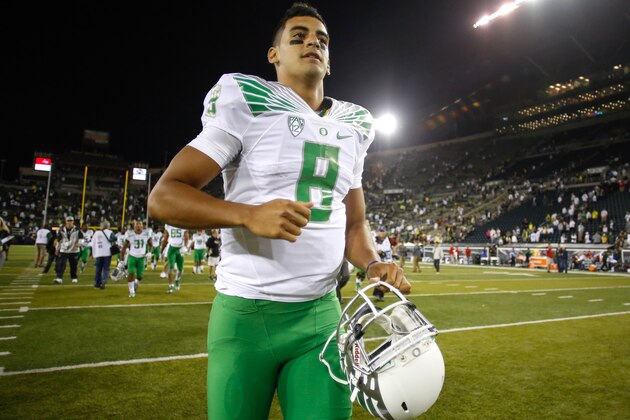 EUGENE, OR - AUGUST 30:  Quarterback Marcus Mariota #8 of the Oregon Ducks heads off the field after defeating the South Dakota Coyotes 62-13 at Autzen Stadium on August 30, 2014 in Eugene, Oregon.  (Photo by Otto Greule Jr/Getty Images)