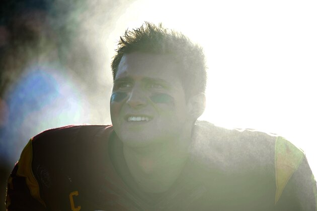 LOS ANGELES, CA - AUGUST 30:  Quarterback Cody Kessler #6 of the USC Trojans watches  from the sidelines with his team leading 31-7 over the Fresno State Bulldogs during the second quarter at Los Angeles Memorial Coliseum on August 30, 2014 in Los Angeles, California.  (Photo by Harry How/Getty Images)