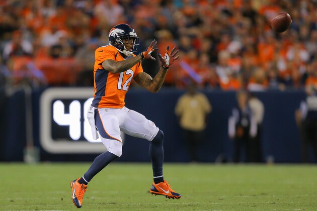 DENVER, CO - AUGUST 23:  Wide receiver Andre Caldwell #12 of the Denver Broncos has a reception for a first down against the Houston Texans during a preseason game at Sports Authority Field at Mile High on August 23, 2014 in Denver, Colorado.  (Photo by Justin Edmonds/Getty Images)
