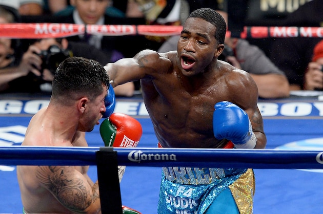 LAS VEGAS, NV - MAY 03:  (R-L) Adrien Broner throws a right at Carlos Molina during their super lightweight bout at the MGM Grand Garden Arena on May 3, 2014 in Las Vegas, Nevada.  (Photo by Ethan Miller/Getty Images)