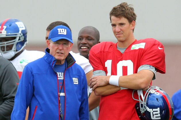Aug 7, 2013; East Rutherford, NJ, USA; New York Giants head coach Tom Coughlin (left) with quarterback Eli Manning (10) during team practice at the Quest Diagnostics Training Center. Mandatory Credit: Brad Penner-USA TODAY Sports