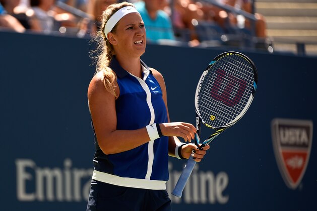 NEW YORK, NY - SEPTEMBER 03:  Victoria Azarenka of Belarus reacts against Ekaterina Makarova of Russia during their women's singles quarterfinal match on Day Ten of the 2014 US Open at the USTA Billie Jean King National Tennis Center on September 3, 2014 in the Flushing neighborhood of the Queens borough of New York City.  (Photo by Alex Goodlett/Getty Images)