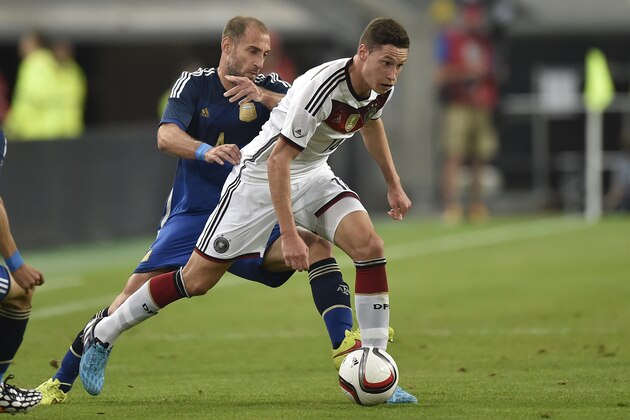 Argentina's Javier Mascherano, left, and Germany's Julian Draxler challenge for the ball during the friendly soccer match between Germany and Argentina in Duesseldorf, Germany, Wednesday, Sept. 3, 2014. (AP Photo/Martin Meissner) Argentina's Javier Mascherano, left, and Germany's Julian Draxler challenge for the ball during the friendly soccer match between Germany and Argentina in Duesseldorf, Germany, Wednesday, Sept. 3, 2014. (AP Photo/Martin Meissner)