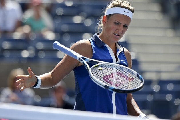 Victoria Azarenka, of Belarus, slams her racket down after losing a point against Ekaterina Makarova, of Russia, during the quarterfinals of the 2014 U.S. Open tennis tournament, Wednesday, Sept. 3, 2014, in New York. (AP Photo/Mike Groll)