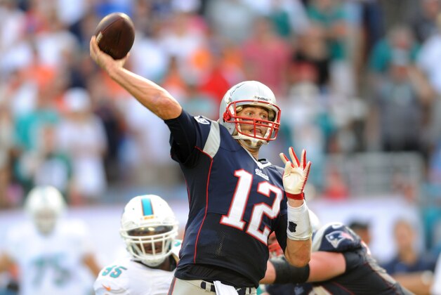 Dec 15, 2013; Miami Gardens, FL, New England Patriots quarterback Tom Brady (12) throws a pass against the Miami Dolphins during the second half at Sun Life Stadium. The Dolphins won 24-20. Mandatory Credit: Steve Mitchell-USA TODAY Sports