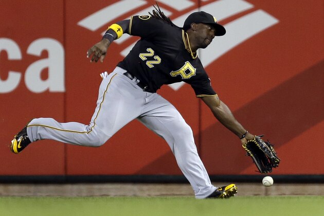 Pittsburgh Pirates center fielder Andrew McCutchen has trouble reaching a double by St. Louis Cardinals' Jhonny Peralta during the seventh inning of a baseball game Tuesday, Sept. 2, 2014, in St. Louis. Peralta scored on a wild pitch later in the inning. (AP Photo/Jeff Roberson)