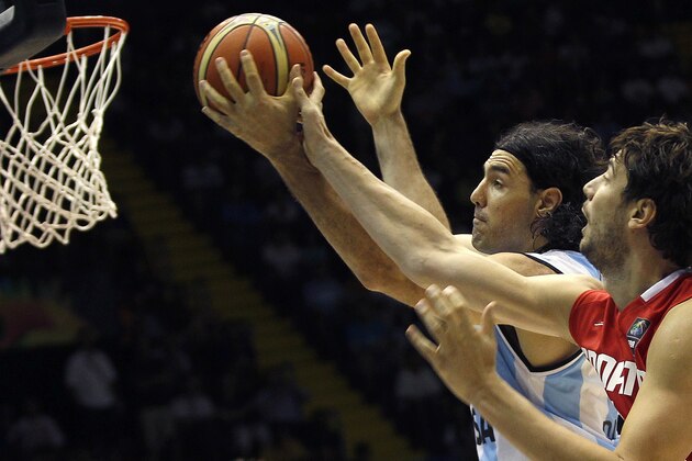 Croatia's Ante Tomic, right, vies with Argentina's Luis Scola, left, during the Group B Basketball World Cup match between Argentina and Croatia in Seville, Spain, Sunday, Aug. 31, 2014. The 2014 Basketball World Cup competition will take place in various cities in Spain from Aug. 30 through to Sept. 14. (AP Photo/Miguel Angel Morenatti)