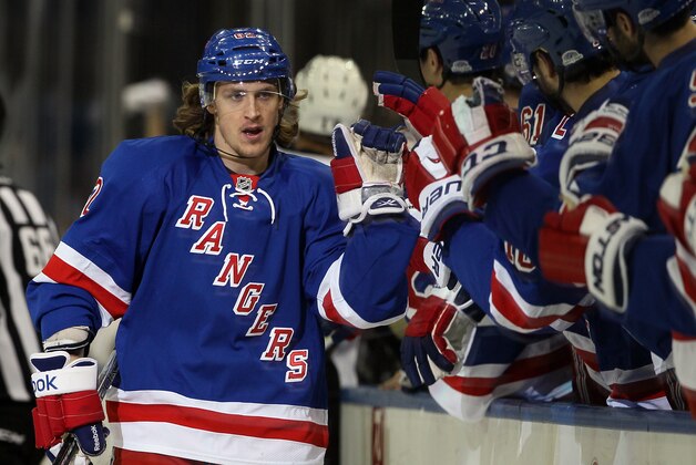 NEW YORK, NY - MAY 11:  Carl Hagelin #62 of the New York Rangers celebrates with teammates after scoring in the first period against the Pittsburgh Penguins during Game Six of the Second Round of the 2014 NHL Stanley Cup Playoffs at Madison Square Garden on May 11, 2014 in New York City.  (Photo by Elsa/Getty Images)