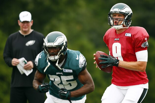 Philadelphia Eagles quarterback Nick Foles (9) runs a drill with running back LeSean McCoy (25) during NFL football training camp Friday, Aug. 1, 2014, in Philadelphia. (AP Photo/Matt Rourke) Philadelphia Eagles quarterback Nick Foles (9) runs a drill with running back LeSean McCoy (25) during NFL football training camp Friday, Aug. 1, 2014, in Philadelphia. (AP Photo/Matt Rourke)