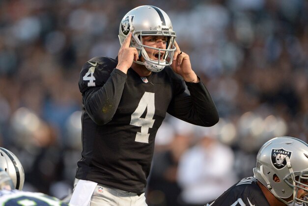 Aug 28, 2014; Oakland, CA, USA; Oakland Raiders quarterback Derek Carr (4) gestures during the game against the Seattle Seahawks at O.co Coliseum. Mandatory Credit: Kirby Lee-USA TODAY Sports