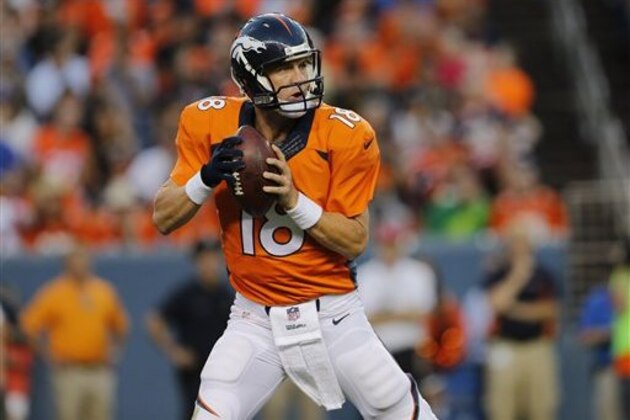 Denver Broncos quarterback Peyton Manning (18) throws against the Houston Texans during the first half of an NFL preseason football game, Saturday, Aug. 23, 2014, in Denver. (AP Photo/Joe Mahoney)