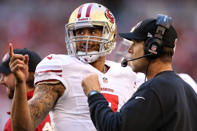 GLENDALE, AZ - DECEMBER 29:  (L-R) Colin Kaepernick #7 of the San Francisco 49ers talks with head coach Jim Harbaugh on the sidelines against the Arizona Cardinals during a game at University of Phoenix Stadium on December 29, 2013 in Glendale, Arizona.  (Photo by Christian Petersen/Getty Images)