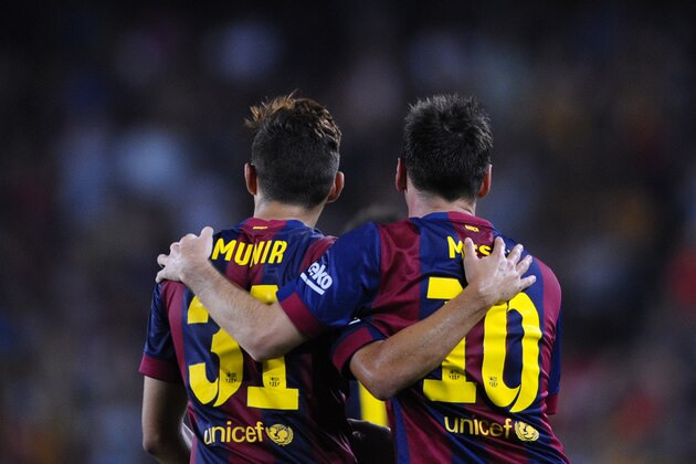 FC Barcelona's Lionel Messi from Argentina, right, reacts after scoring with his teammate Munir against Elche during a Spanish La Liga soccer match at the Camp Nou stadium in Barcelona, Spain, Sunday, Aug. 24, 2014. (AP Photo/Manu Fernandez)