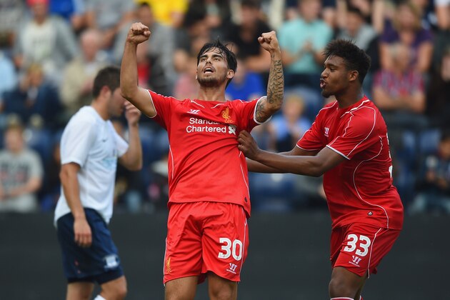 PRESTON, LANCASHIRE - JULY 19:  Suso of Liverpool celebrates scoring with team mate Jordan Ibe during the pre season friendly match between Preston North End and Liverpool at Deepdale on July 19, 2014 in Preston, Lancashire.  (Photo by Michael Regan/Getty Images)