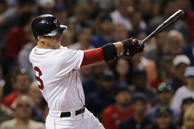 Boston Red Sox' Will Middlebrooks swings through on a double as he breaks up a no-hitter by Los Angeles Angels starting pitcher Matt Shoemaker during the seventh inning of a baseball game at Fenway Park in Boston, Thursday, Aug. 21, 2014. (AP Photo/Charles Krupa)