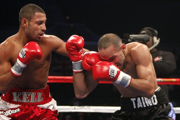 Kell Brook, right, of England lands a left punch to the face of Luis Galarza in a Welterweight fight in Atlantic City N.J. Saturday, Dec. 17, 2011. Brook won by a TKO in the fifth round. (AP Photo/Rich Schultz)