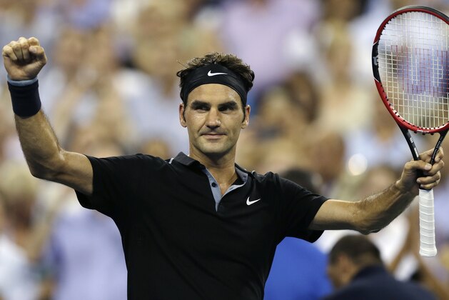 Roger Federer, of Switzerland, raises his arms after defeating Roberto Bautista Agut, of Spain, 6-4, 6-3, 6-2 during the fourth round of the U.S. Open tennis tournament, Tuesday, Sept. 2, 2014, in New York. (AP Photo/Charles Krupa)