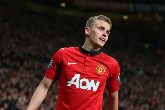 MANCHESTER, ENGLAND - MAY 06:  James Wilson of Manchester United celebrates scoring the second goal during the Barclays Premier League match between Manchester United and Hull City at Old Trafford on May 6, 2014 in Manchester, England.  (Photo by Alex Livesey/Getty Images)