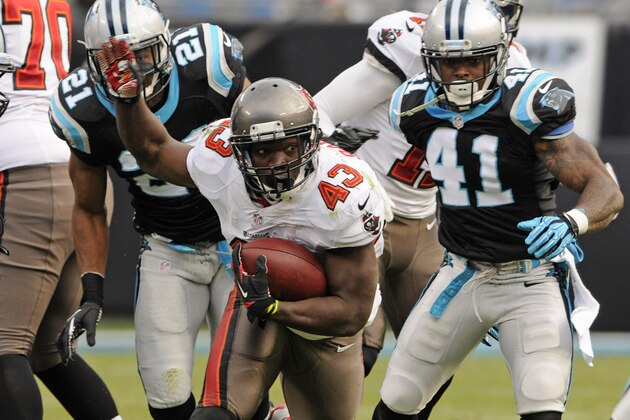 FILE - In this Dec. 1, 2013 file photo, Tampa Bay Buccaneers' Bobby Rainey (43) against the Carolina Panthers in the second half of an NFL football game in Charlotte, N.C. Every year in the NFL, examples abound of players in prominent roles in December who were barely noticeable in September. Minnesota's Cordarrelle Patterson, Philadelphia's Nick Foles and Tampa Bay's Bobby Rainey are a few of those. (AP Photo/Mike McCarn, File)